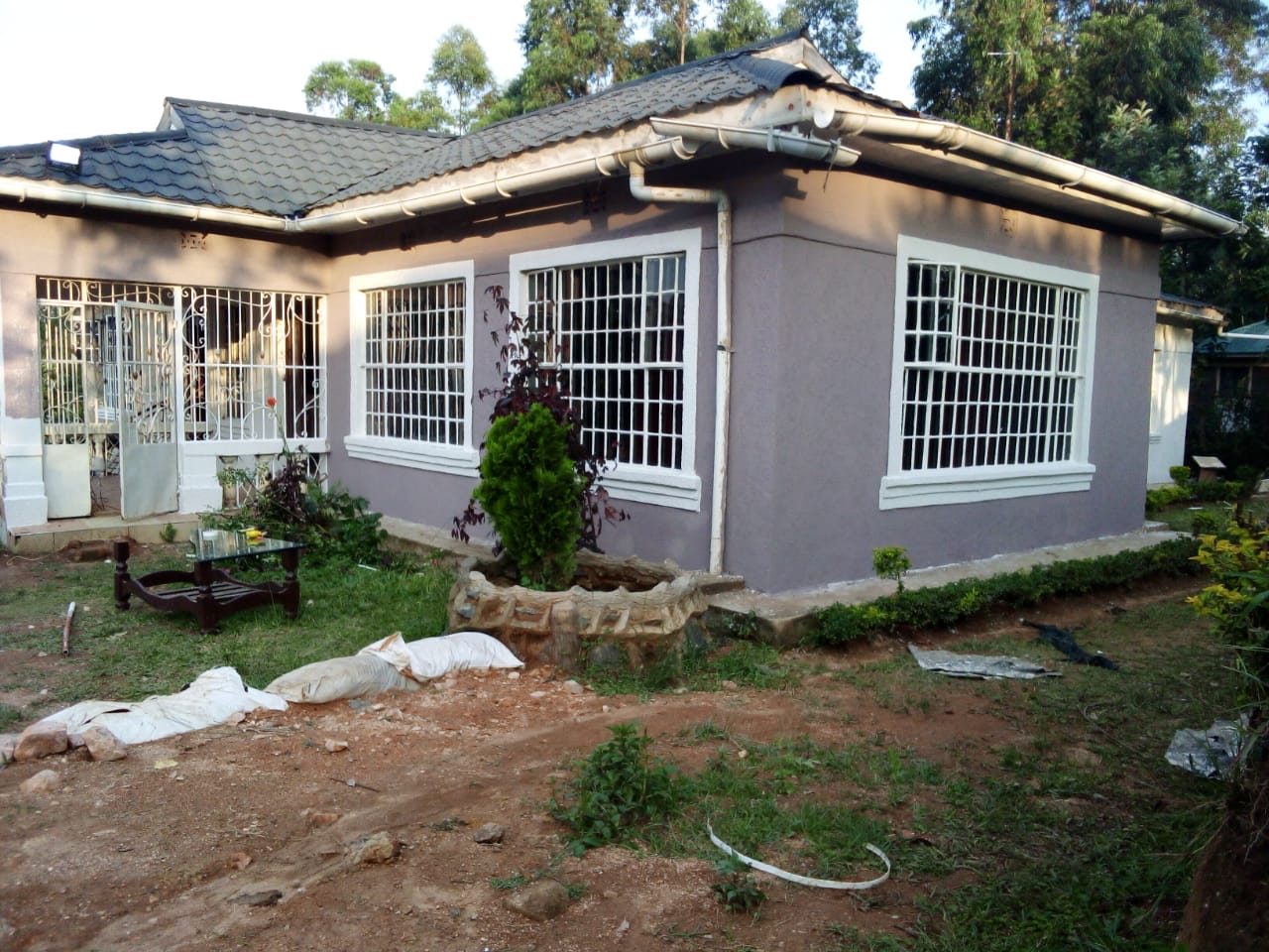Lavender-grey bungalow and garden