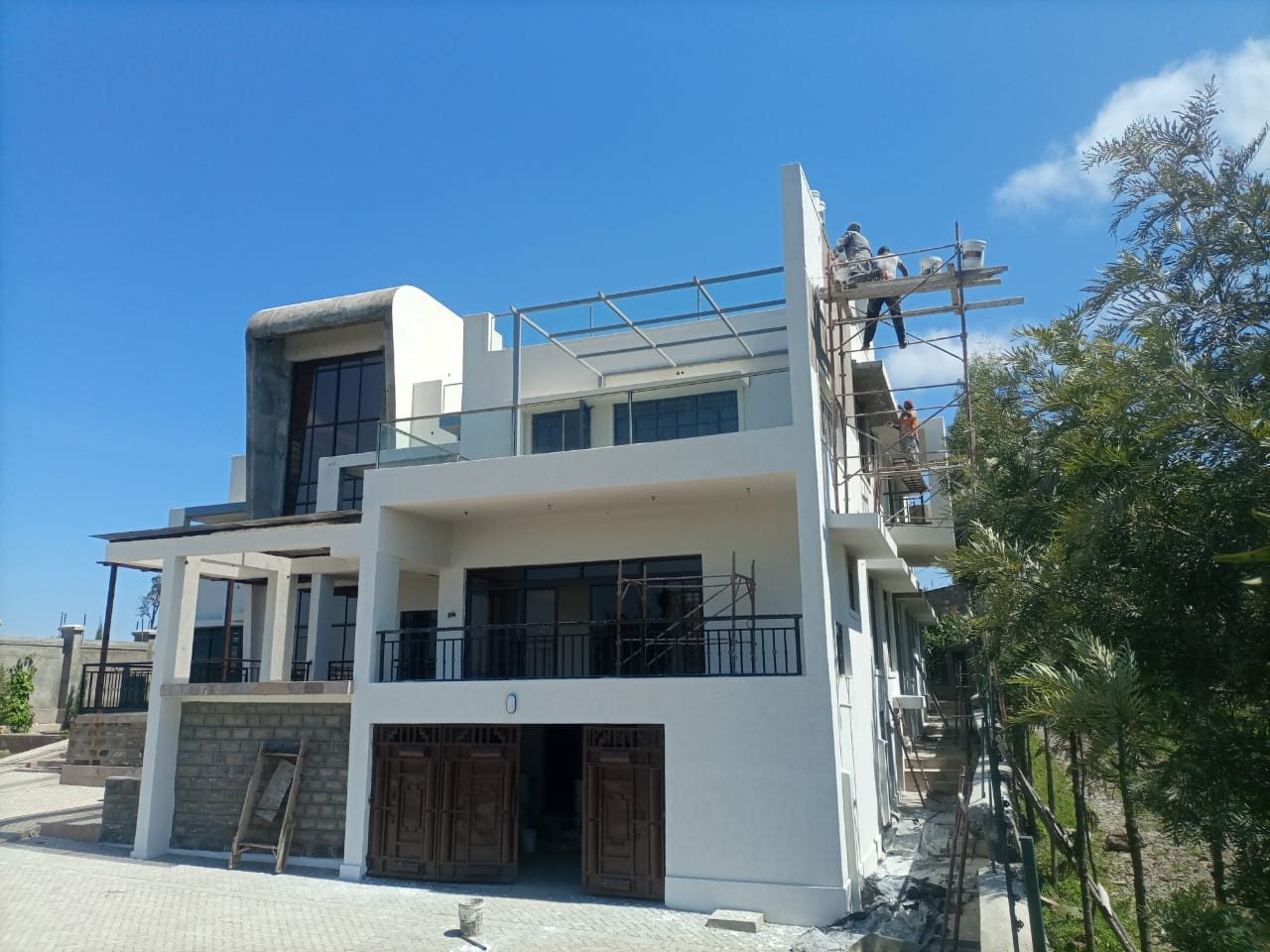 Modern white villa with paved drive