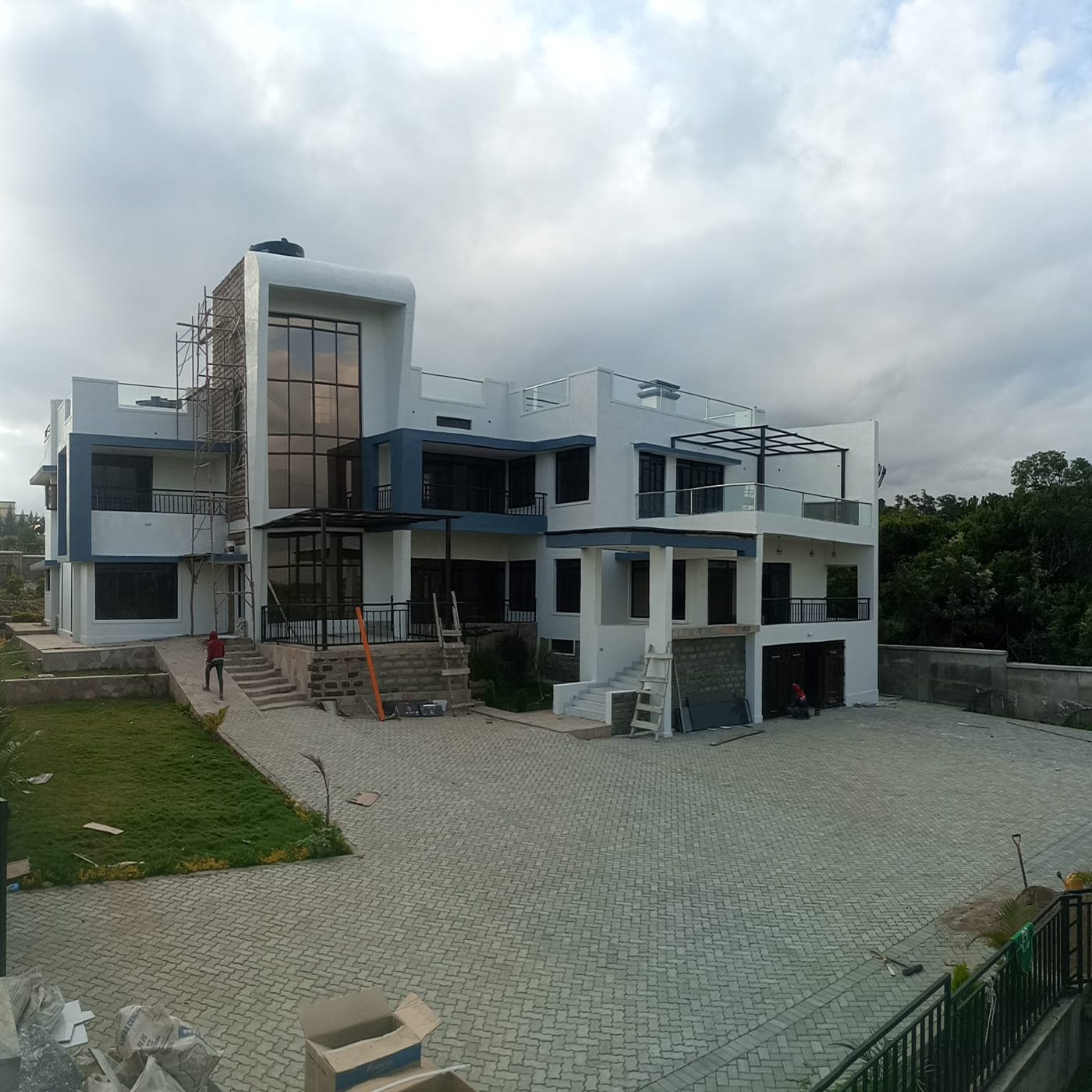 Modern white villa on cabro paving